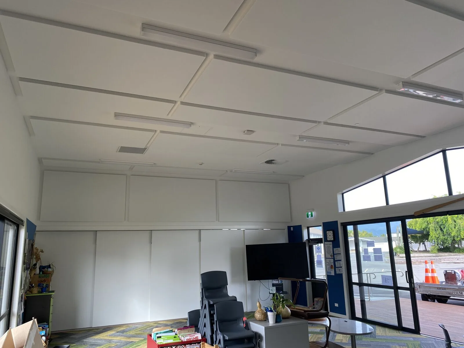 Finished white ceiling and upper-wall acoustic panels above patterned carpet in a Parklands School learning space