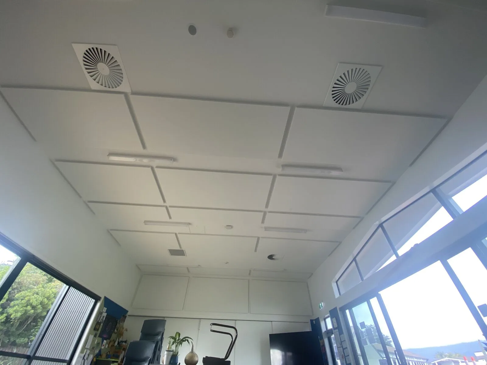 Finished white acoustic ceiling panels in a Parklands School learning space with windows